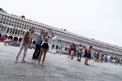 Group of people in front of building