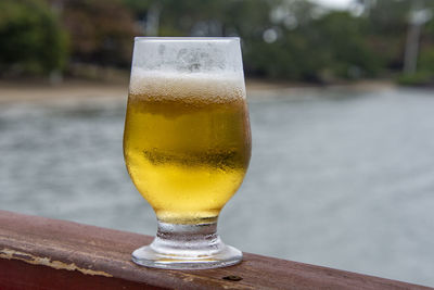 Close-up of beer glass on table