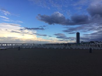 View of beach against cloudy sky