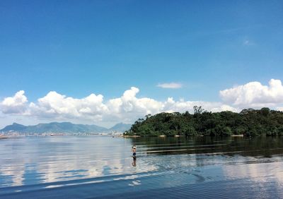 Scenic view of swimming pool by sea against sky