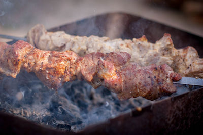 Close-up of meat on barbecue grill