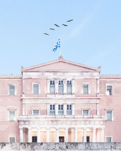 Low angle view of building against blue sky