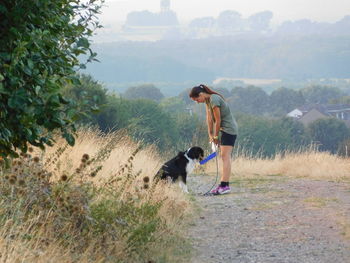 Full length of man with dog