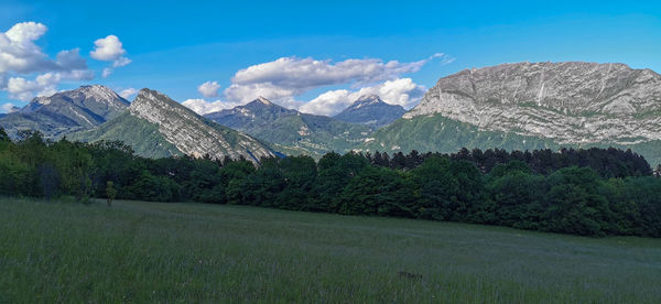 Scenic view of landscape and mountains against sky