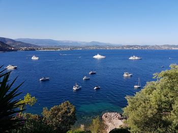 High angle view of sea against clear blue sky