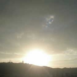 Sun shining through clouds