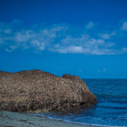 Scenic view of sea against blue sky