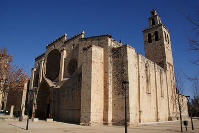 Low angle view of building against clear blue sky