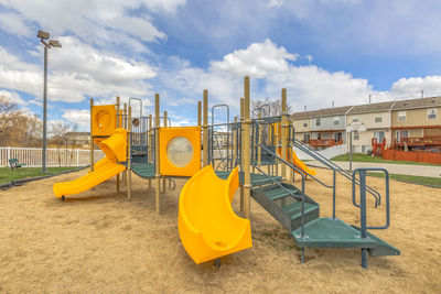 Playground in park against sky