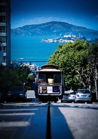 View of road and mountains against blue sky