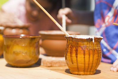 Pottery wheel workshop for children unfocuseds in background