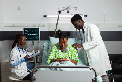 Doctor examining patient at clinic