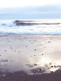 Scenic view of beach against sky