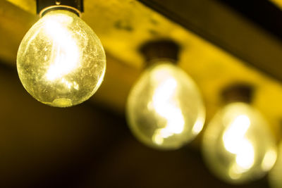 Low angle view of illuminated light bulb