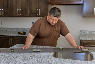 Side view of man working in workshop