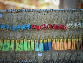 Close-up of multi colored decorations hanging at market stall