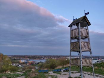 Low angle view of building on field against sky