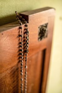 Close-up of rope tied on wooden table