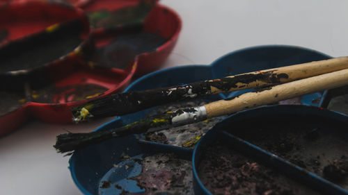 High angle view of paintbrushes on table