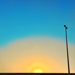 Low angle view of street light against clear sky