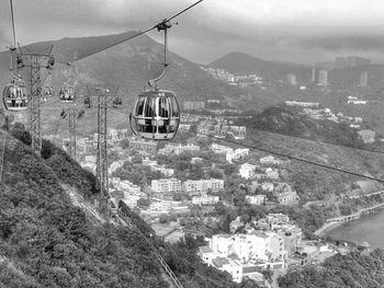 High angle view of overhead cable cars and buildings in city