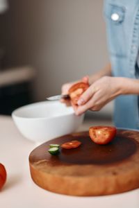 Midsection of person preparing food on table