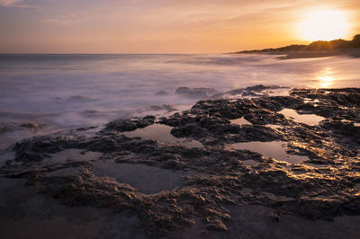 Scenic view of sea against sky during sunset