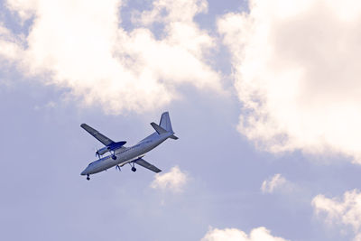 Low angle view of airplane flying in sky