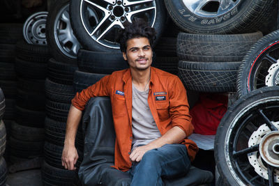 Portrait of a smiling young man in car