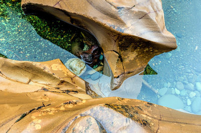 High angle view of rocks by sea