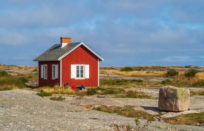House on field against sky
