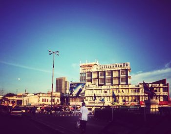Low angle view of buildings against blue sky