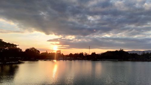 Scenic view of lake against sky during sunset