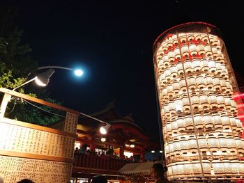 Low angle view of illuminated building at night