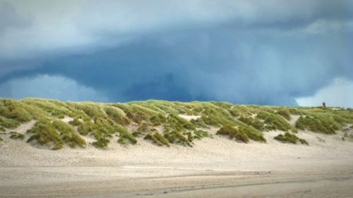 Scenic view of beach against sky