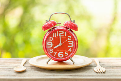 Close-up of clock on table