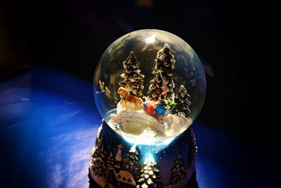 Close-up of snow globe on table