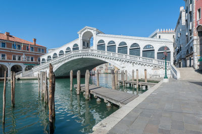 View of canal and buildings against sky