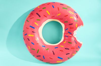 Directly above shot of donut against blue background