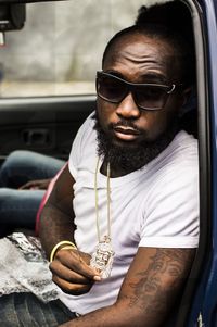 Portrait of young man wearing sunglasses