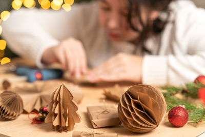 Midsection of woman holding christmas tree