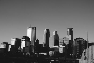 Low angle view of skyscrapers against clear sky