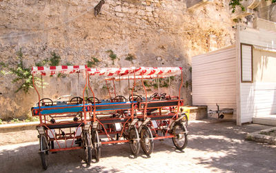 Bicycles on road against building in city