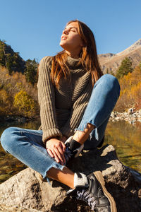 Nice girl traveler on a mountain lake