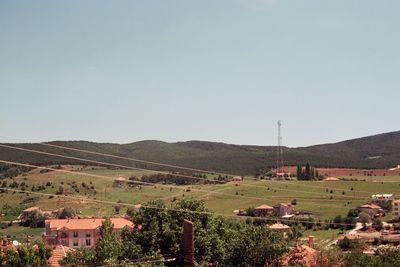 Scenic view of field against clear sky