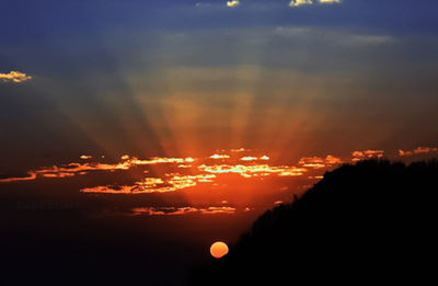 Scenic view of dramatic sky during sunset