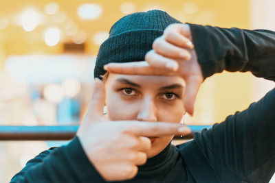 Close-up portrait of young man holding ice cream
