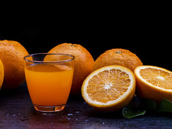 Orange fruits in glass