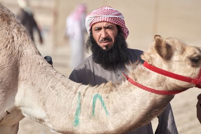 Portrait of man with horse