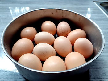 High angle view of eggs in container on table